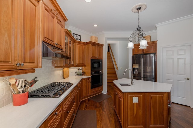 10508 Pontofino Cir, Trinity, FL 34655 - kitchen with black appliances, under cabinet range hood, brown cabinets, ornamental molding, and recessed lighting