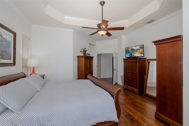 10508 Pontofino Cir, Trinity, FL 34655 - bedroom with wood finished floors, a tray ceiling, ornamental molding, and ceiling fan
