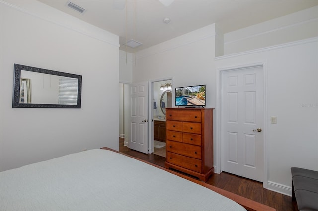 10508 Pontofino Cir, Trinity, FL 34655 - bedroom with dark wood-style floors and connected bathroom