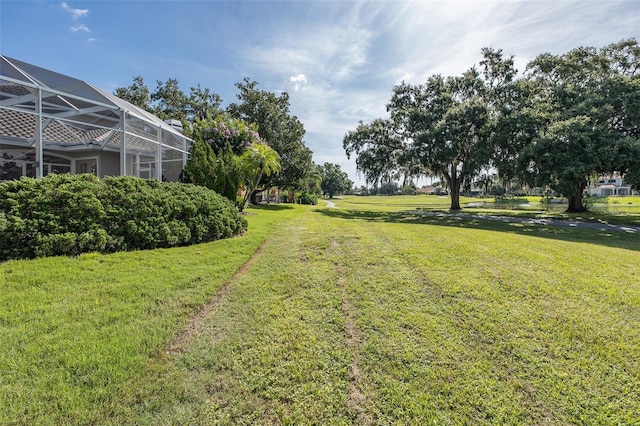10508 Pontofino Cir, Trinity, FL 34655 - view of grassy yard with a lanai