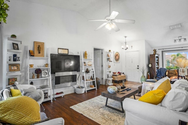 3539 Anniversary Ct, New Port Richey, FL 34653 - living room featuring a ceiling fan, lofted ceiling, wood finished floors, and a chandelier