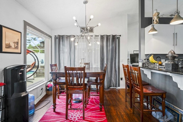 3539 Anniversary Ct, New Port Richey, FL 34653 - dining space with a chandelier, wood finished floors, and vaulted ceiling