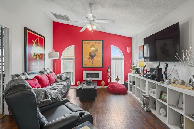 3539 Anniversary Ct, New Port Richey, FL 34653 - living room featuring a ceiling fan, hardwood / wood-style floors, a textured ceiling, and lofted ceiling
