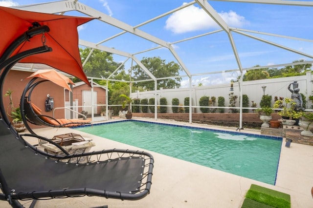 3539 Anniversary Ct, New Port Richey, FL 34653 - outdoor pool with a patio, a shed, glass enclosure, and a fenced backyard