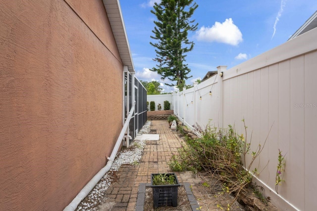 3539 Anniversary Ct, New Port Richey, FL 34653 - view of property exterior featuring a fenced backyard, stucco siding, and a patio