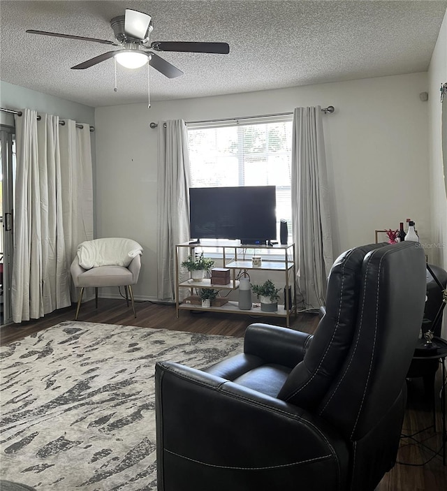 7721 Hillside Ct Unit 203, Hudson, FL 34667 - living room featuring ceiling fan, a textured ceiling, and wood finished floors
