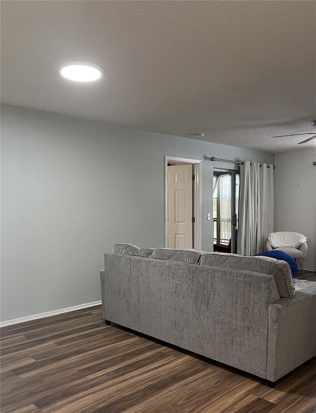 7721 Hillside Ct Unit 203, Hudson, FL 34667 - living room with dark wood finished floors and a textured ceiling