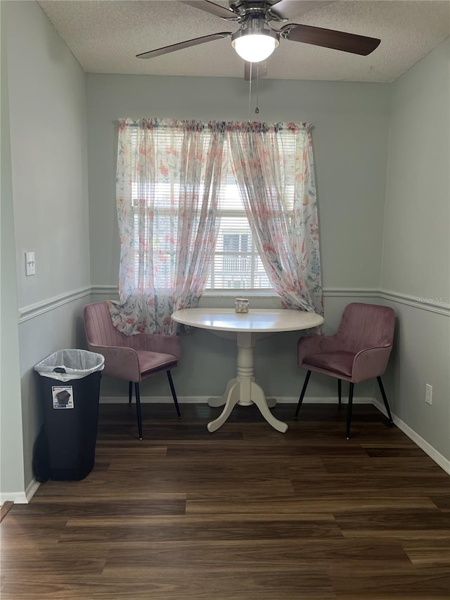 7721 Hillside Ct Unit 203, Hudson, FL 34667 - living area featuring wood finished floors, ceiling fan, and a textured ceiling