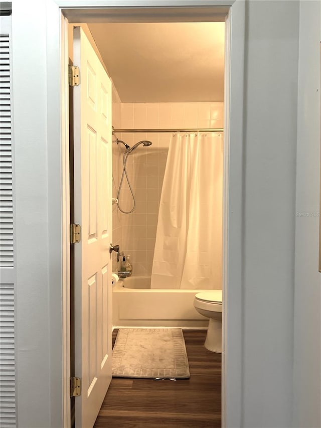 7721 Hillside Ct Unit 203, Hudson, FL 34667 - full bath with wood finished floors and shower / bath combination with curtain