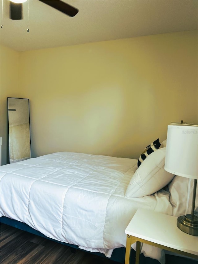 7721 Hillside Ct Unit 203, Hudson, FL 34667 - bedroom featuring wood finished floors and a ceiling fan