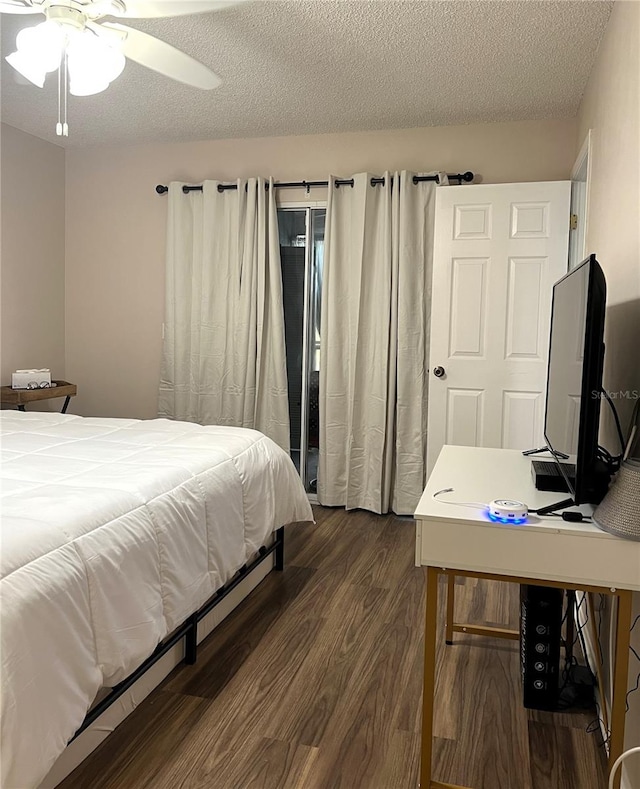 7721 Hillside Ct Unit 203, Hudson, FL 34667 - bedroom with dark wood-type flooring and a textured ceiling