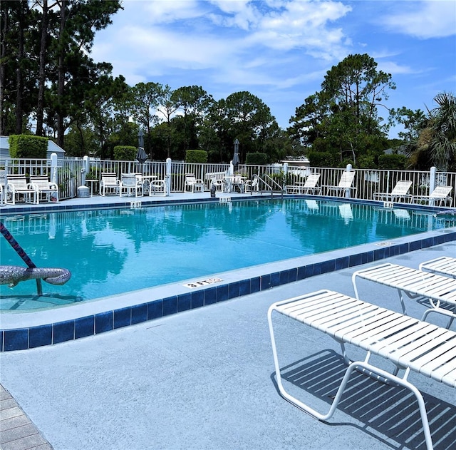 7721 Hillside Ct Unit 203, Hudson, FL 34667 - community pool with a patio area