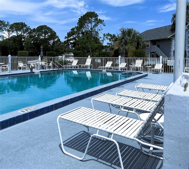 7721 Hillside Ct Unit 203, Hudson, FL 34667 - community pool featuring a patio