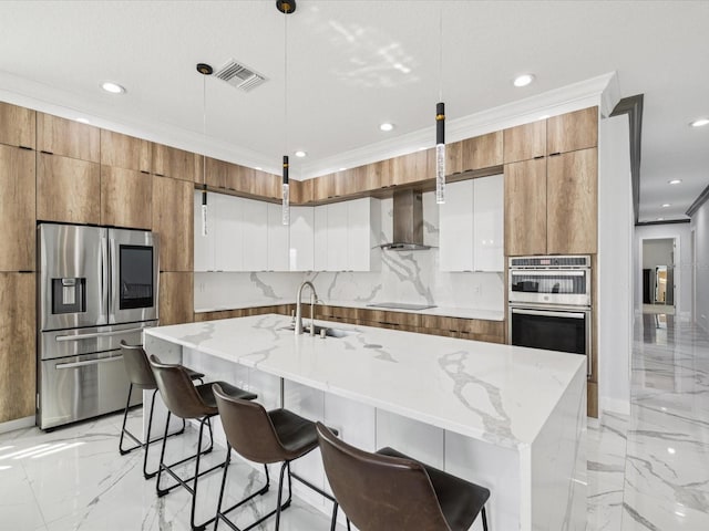 5621 Egrets Pl, New Port Richey, FL 34652 - kitchen featuring stainless steel appliances, modern cabinets, brown cabinetry, light marble finish floors, and recessed lighting