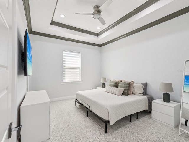 5621 Egrets Pl, New Port Richey, FL 34652 - carpeted bedroom with ornamental molding, a tray ceiling, a ceiling fan, and recessed lighting
