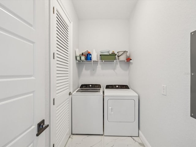 5621 Egrets Pl, New Port Richey, FL 34652 - laundry room featuring light marble finish floors and washing machine and dryer