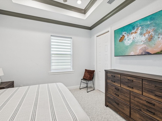 5621 Egrets Pl, New Port Richey, FL 34652 - bedroom featuring a tray ceiling, light carpet, and ornamental molding
