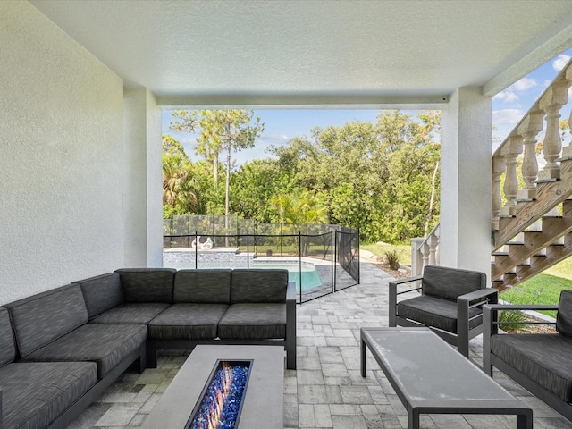 5621 Egrets Pl, New Port Richey, FL 34652 - view of patio with an outdoor living space with a fire pit and stairs