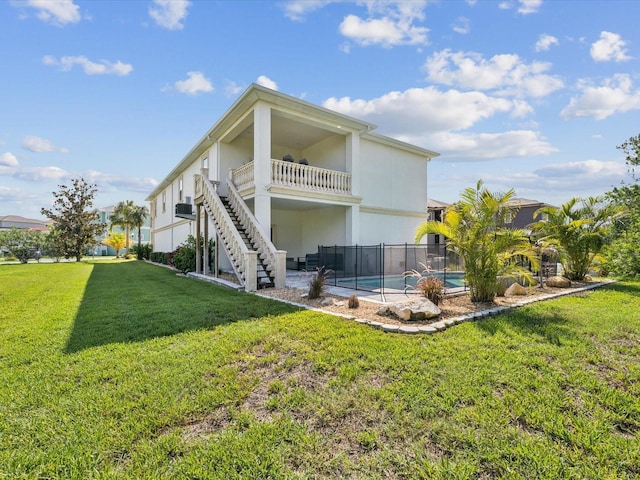 5621 Egrets Pl, New Port Richey, FL 34652 - rear view of property featuring stairway and stucco siding