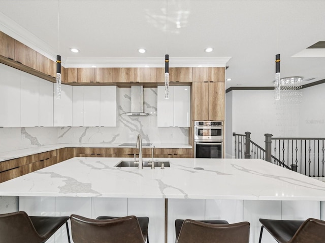 5621 Egrets Pl, New Port Richey, FL 34652 - kitchen with modern cabinets, brown cabinetry, recessed lighting, wall chimney range hood, and pendant lighting