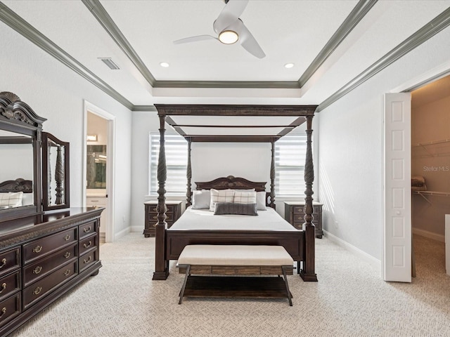 5621 Egrets Pl, New Port Richey, FL 34652 - bedroom with a raised ceiling, light colored carpet, crown molding, ensuite bathroom, and ceiling fan
