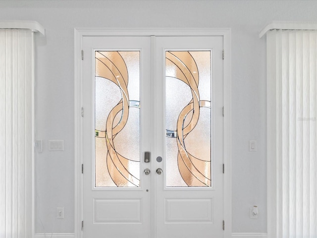 5621 Egrets Pl, New Port Richey, FL 34652 - foyer entrance with french doors and healthy amount of natural light