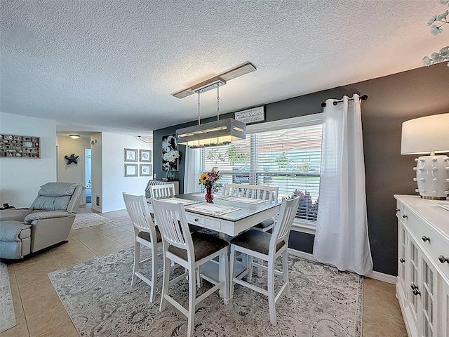 12817 2nd Isle, Hudson, FL 34667 - dining room featuring a textured ceiling and light tile patterned floors