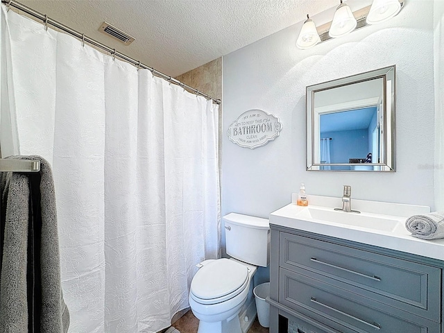 12817 2nd Isle, Hudson, FL 34667 - full bathroom with a textured ceiling and vanity