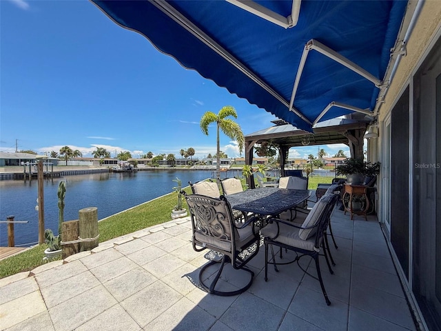 12817 2nd Isle, Hudson, FL 34667 - view of patio / terrace featuring a water view and outdoor dining space
