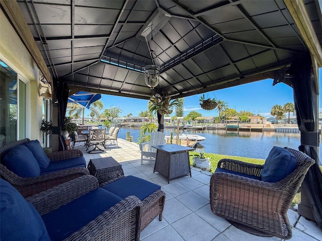 12817 2nd Isle, Hudson, FL 34667 - view of patio / terrace featuring an outdoor hangout area, a water view, and outdoor dining area