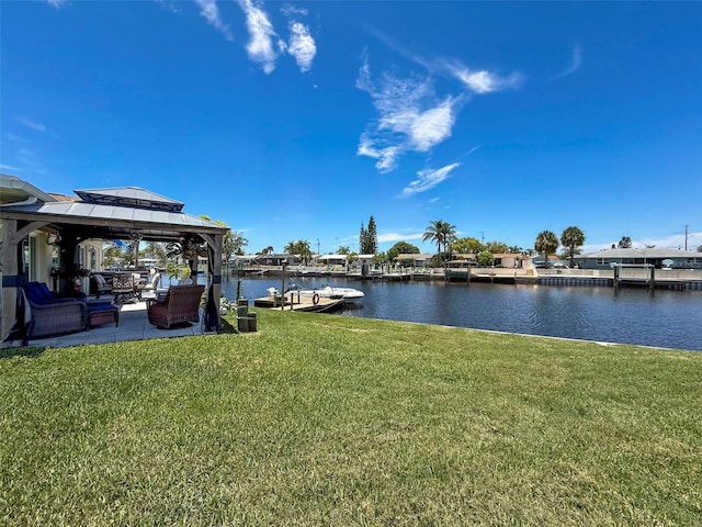 12817 2nd Isle, Hudson, FL 34667 - view of green lawn with a water view, a gazebo, and a dock