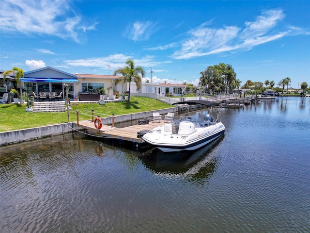 12817 2nd Isle, Hudson, FL 34667 - dock area with a water view, a lawn, and a patio area