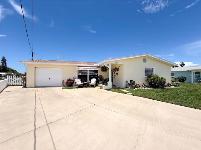 12817 2nd Isle, Hudson, FL 34667 - ranch-style home featuring concrete driveway, stucco siding, and an attached garage
