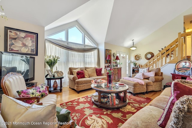 38 Sweet Gum Rd, Howell, NJ 07731 - living room featuring wood finished floors, stairway, and lofted ceiling
