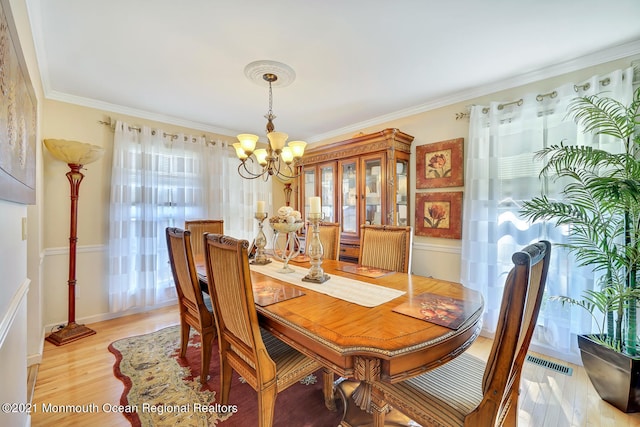 38 Sweet Gum Rd, Howell, NJ 07731 - dining room with a chandelier, ornamental molding, and light wood-style floors