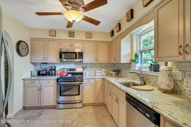 38 Sweet Gum Rd, Howell, NJ 07731 - kitchen featuring stainless steel appliances, decorative backsplash, a ceiling fan, and light stone counters