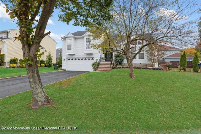 38 Sweet Gum Rd, Howell, NJ 07731 - view of front facade with a garage and asphalt driveway