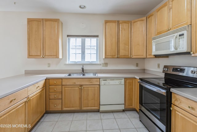 kitchen featuring light tile patterned flooring, light brown cabinets, white appliances, a sink, and light countertops