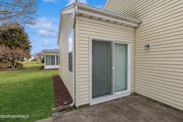 exterior space with a lawn and a patio