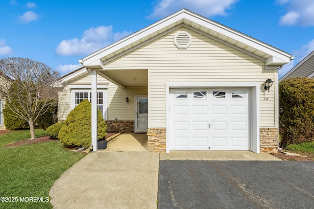 ranch-style house with aphalt driveway, a front yard, stone siding, and an attached garage