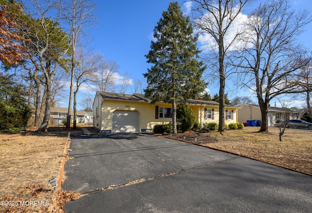 single story home with a garage