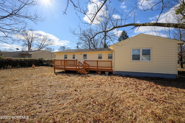 back of house featuring a wooden deck