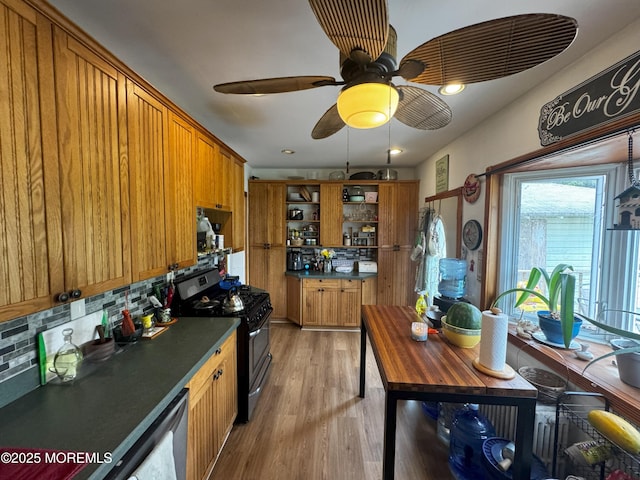 115 Washington St, Long Branch, NJ 07740 - kitchen featuring stainless steel appliances, open shelves, decorative backsplash, and brown cabinetry