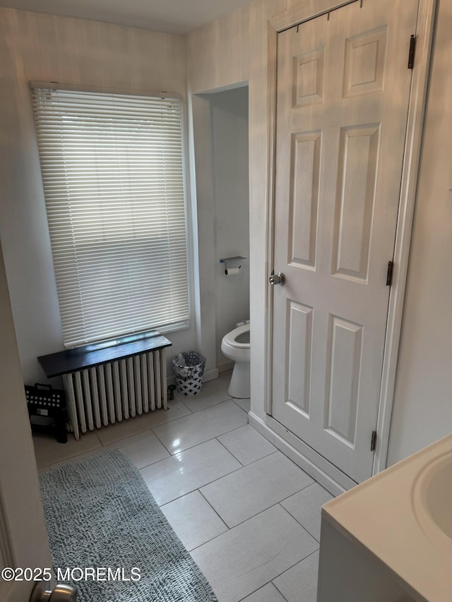 115 Washington St, Long Branch, NJ 07740 - bathroom featuring radiator heating unit, toilet, tile patterned flooring, and vanity