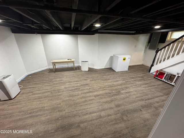 115 Washington St, Long Branch, NJ 07740 - finished below grade area featuring wood finished floors, baseboards, and electric panel