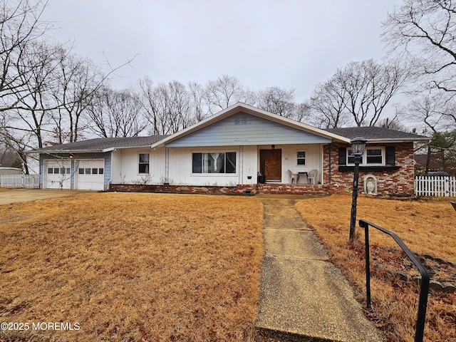 ranch-style home featuring a garage