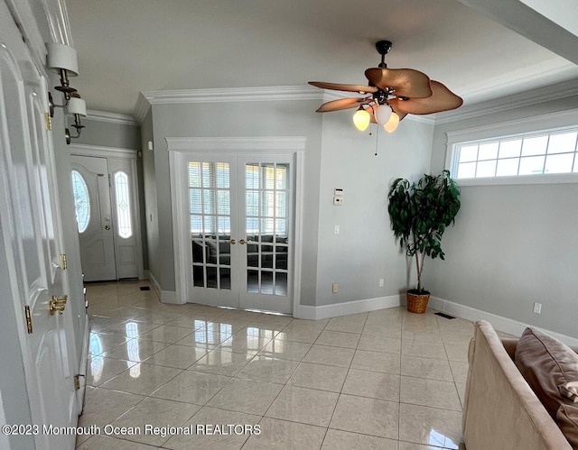 interior space with ceiling fan, ornamental molding, and french doors