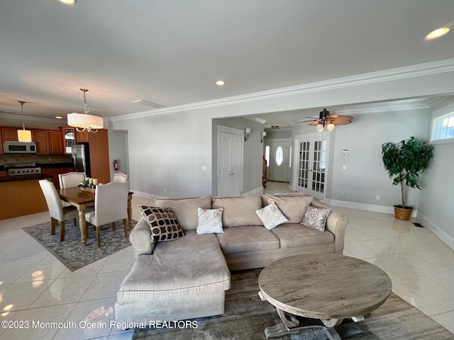 living room with light tile floors, ceiling fan, french doors, and crown molding