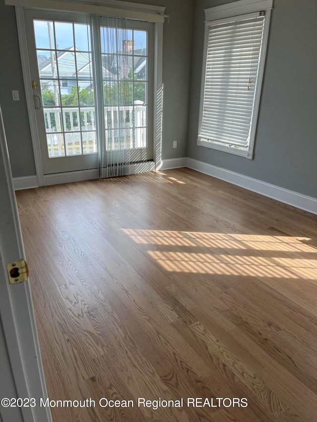 spare room featuring dark hardwood / wood-style floors