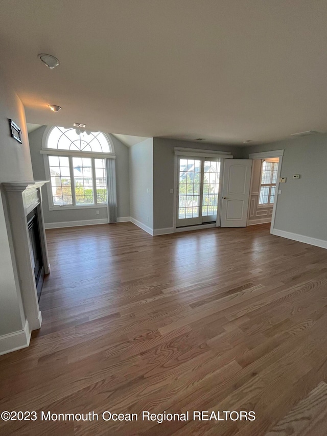 interior space featuring dark hardwood / wood-style flooring and a chandelier